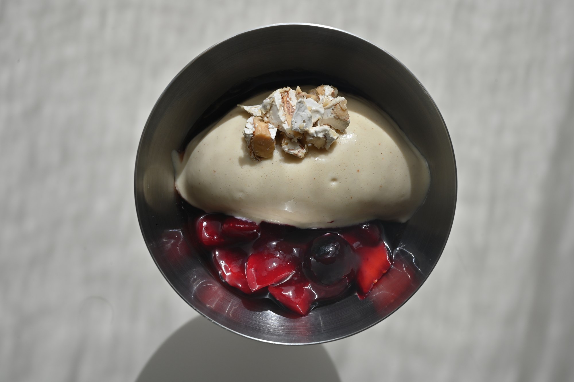 Vanilla ice cream with stewed cherries and meringue